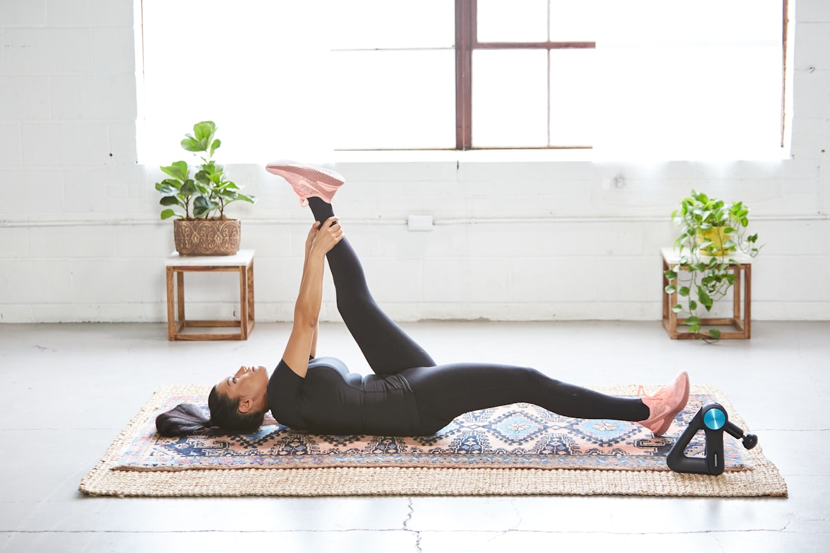 Professional rehabilitation specialist demonstrating stretching technique with proper form